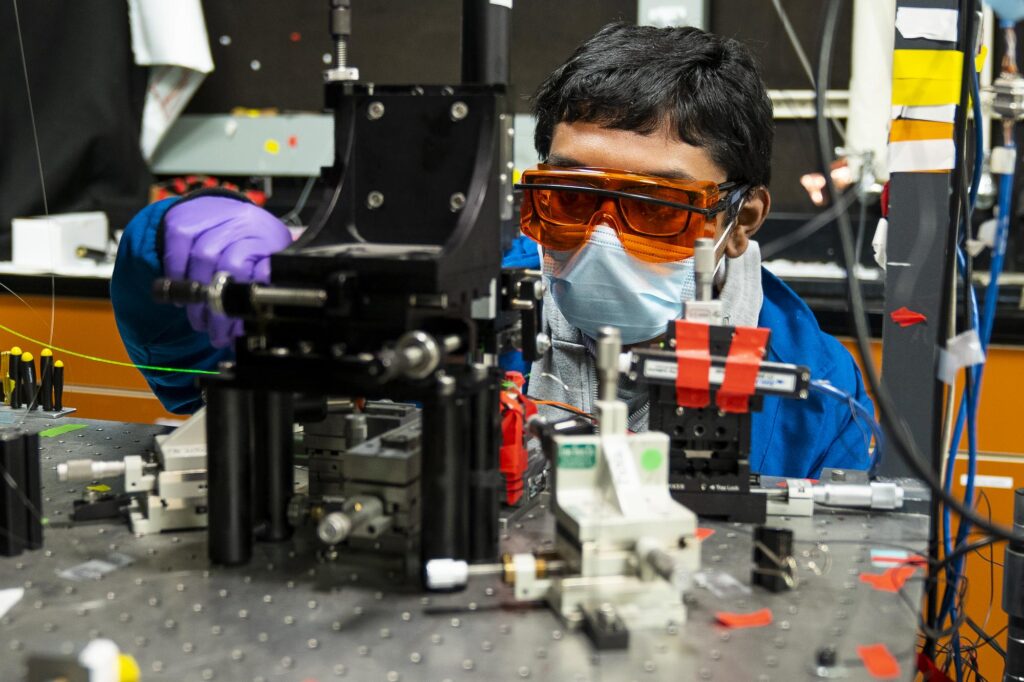 person building a research device.