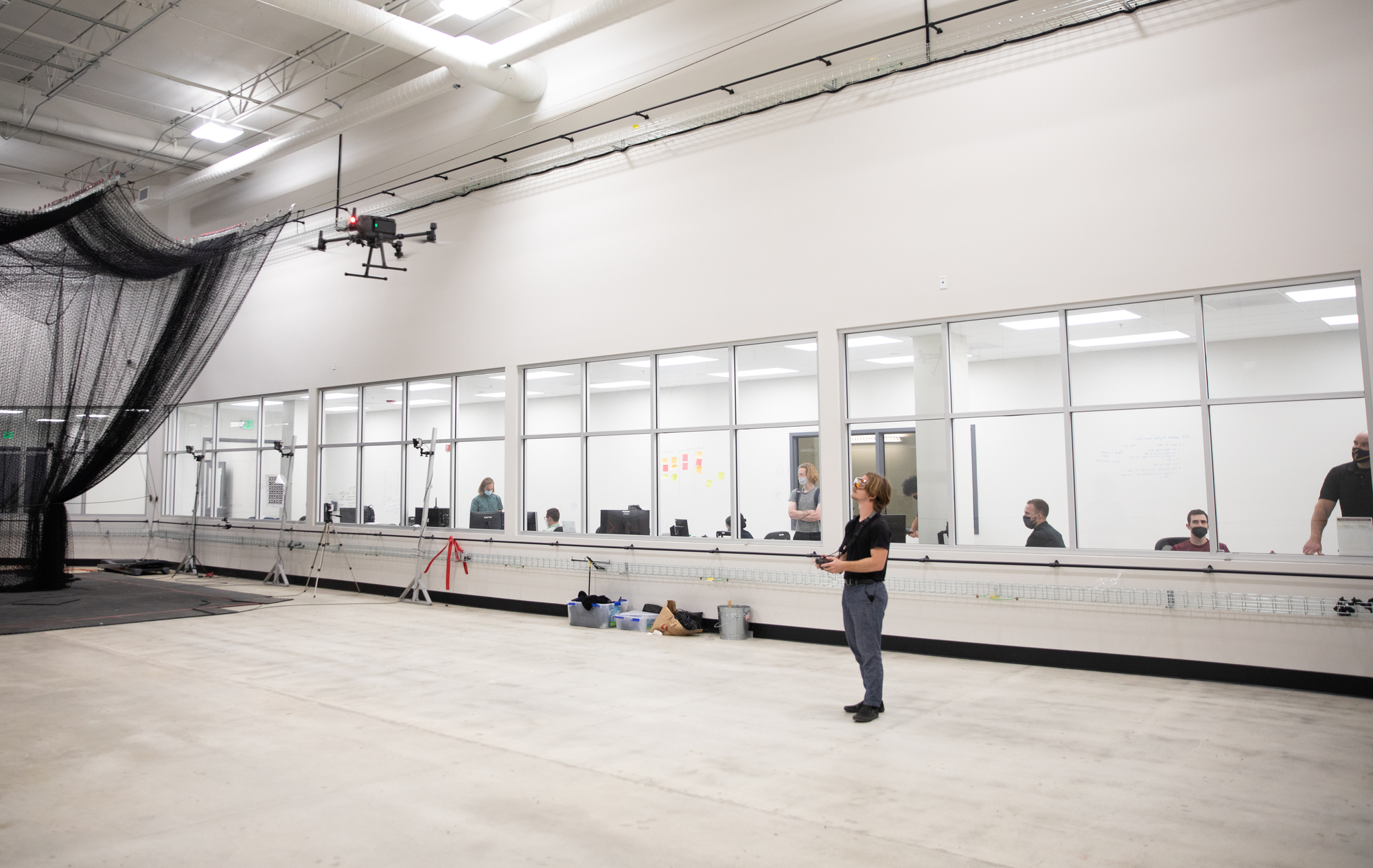 Student at  the Westside Research Park in a drone testing studio. 