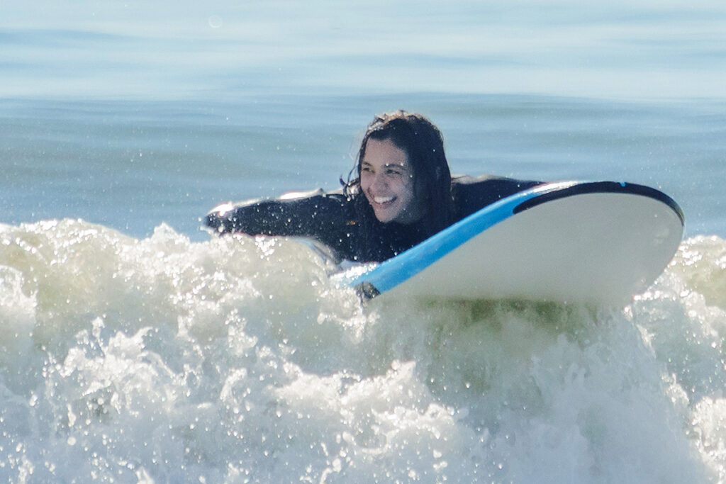 Person learning to surf.