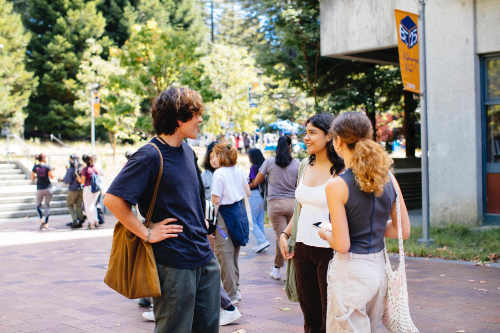 Students on the engineering quad standing around talking.