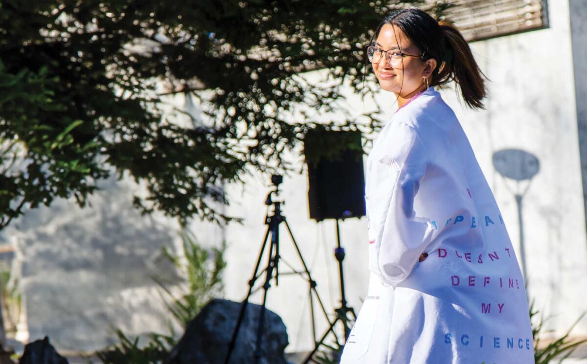 Genomics student wearing a coat